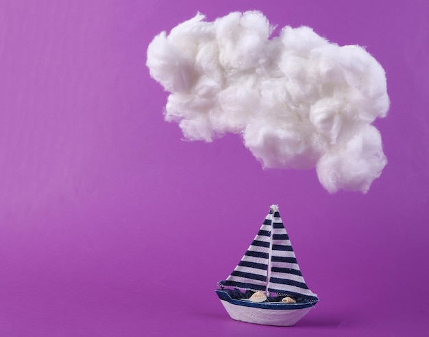 Cloud and sailboat on purple background Concept art Minimalism