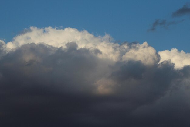 a cloud that has the sun shining through it