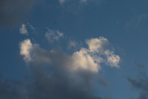 a cloud that is in the sky with the sun shining through it