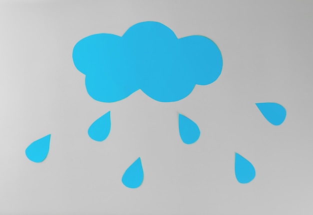 cloud with raindrops made of paper handmade craft applique depression negativity cry concept