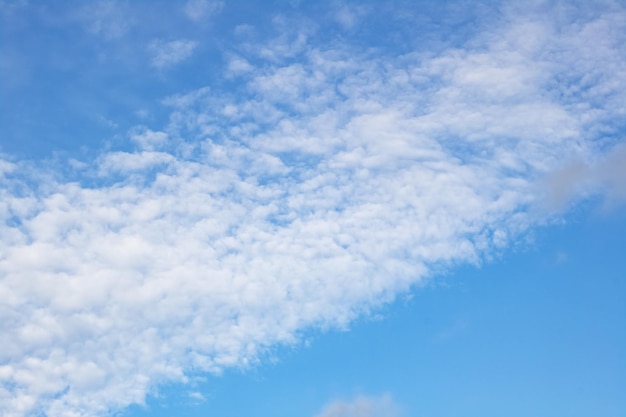 Clouds on the blue sky blurred background