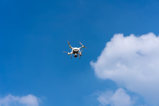 Clouds in the clear sky and drones in flight.