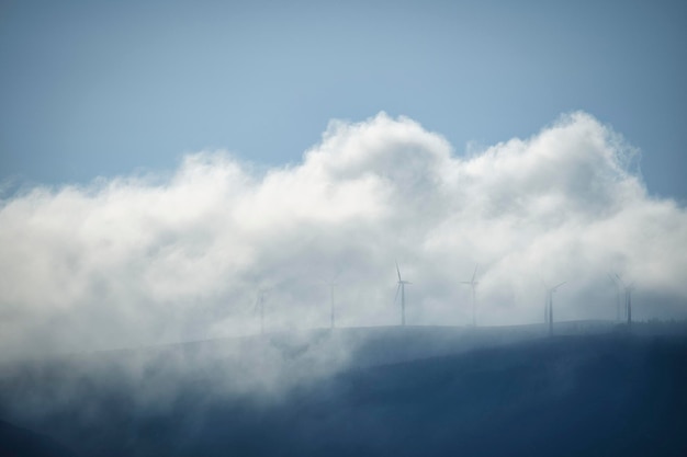 Clouds cover the wind turbines in the mountain Carnota Galicia Spain