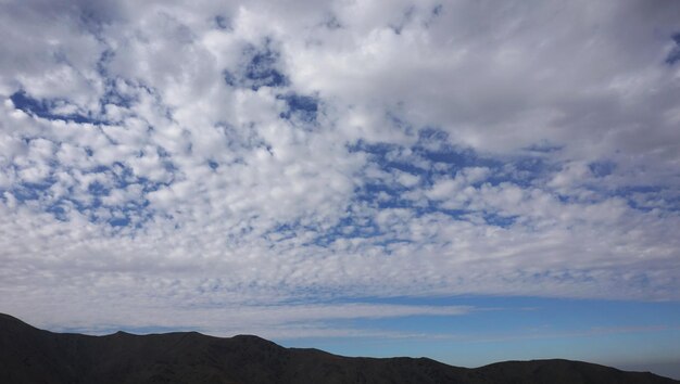 Clouds covered the sky over the mountains