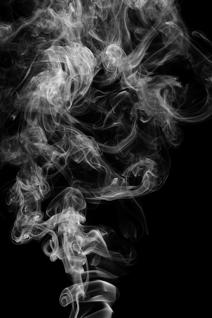 Clouds of curls of smoke on a black background.