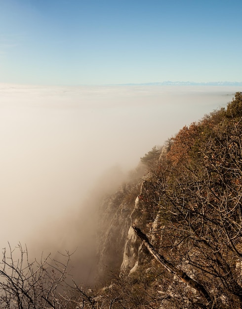 Clouds drift amid rocky cliffs Trieste