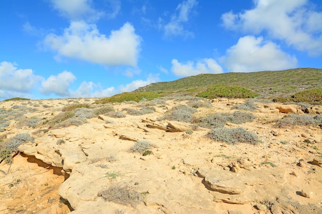 Clouds over a green hill in Argentiera Sardinia