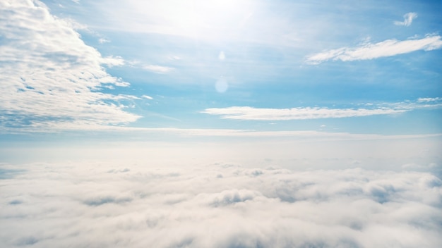 Clouds on the horizon. Aerial photography. Blue sky above the clouds