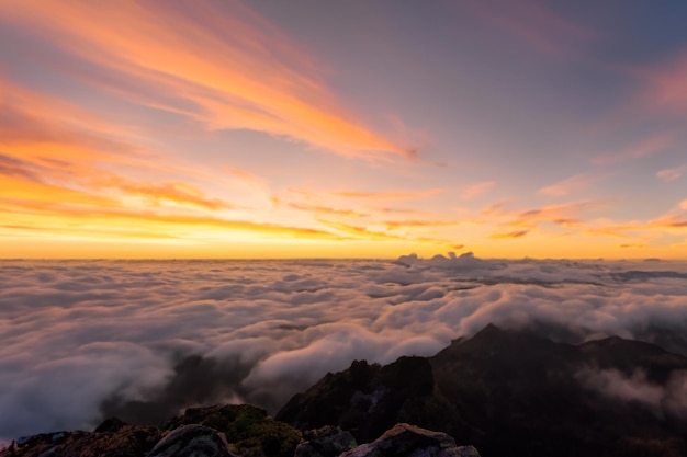 the clouds over the mountains are beautiful with a sunrise and very harmonious atmosphere