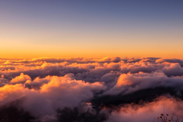 the clouds over the mountains are beautiful with a sunrise and very harmonious atmosphere