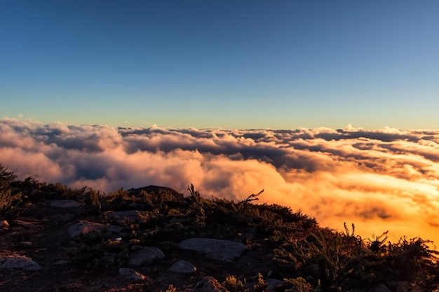 the clouds over the mountains are beautiful with a sunrise and very harmonious atmosphere