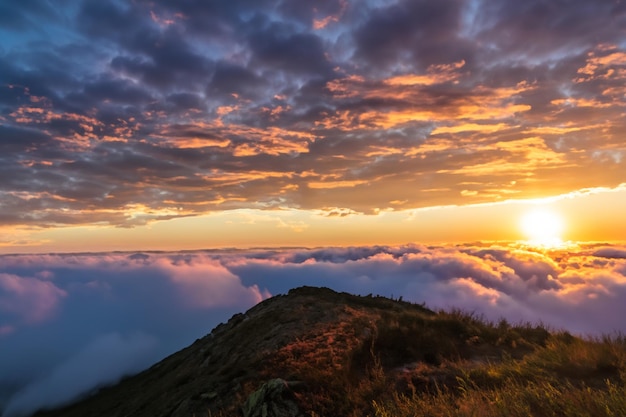 the clouds over the mountains are beautiful with a sunrise and very harmonious atmosphere