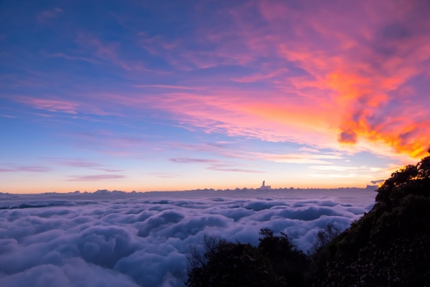 the clouds over the mountains are beautiful with a sunrise and very harmonious atmosphere