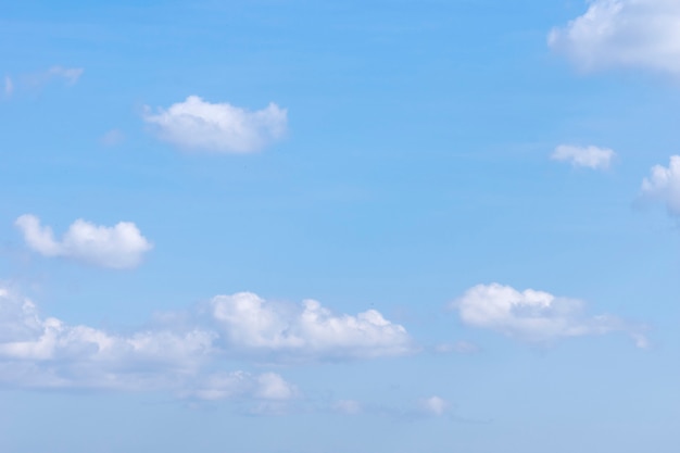 Clouds and rainbow in the blue sky