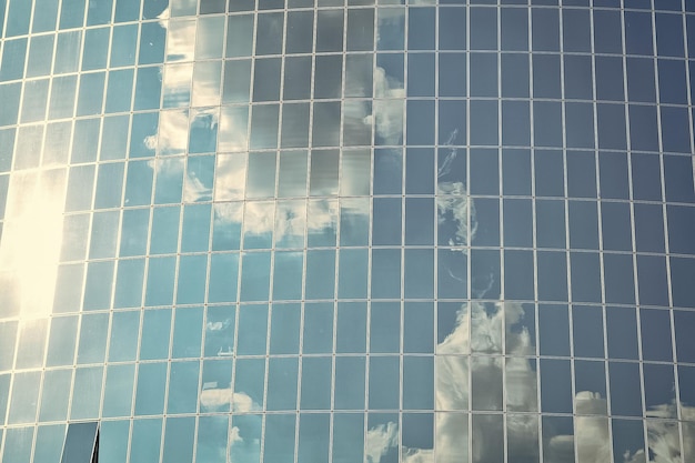 Clouds reflected on glass facade wall of building cloudy blue
sky reflection in windows modern glass architecture architecture
background structure and design future and development