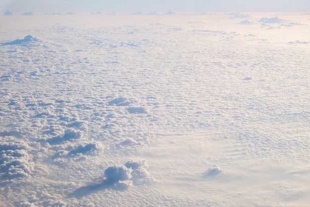 Clouds and sky, aerial view from airplane window.