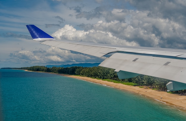 Clouds and sky as seen through window of an aircraft