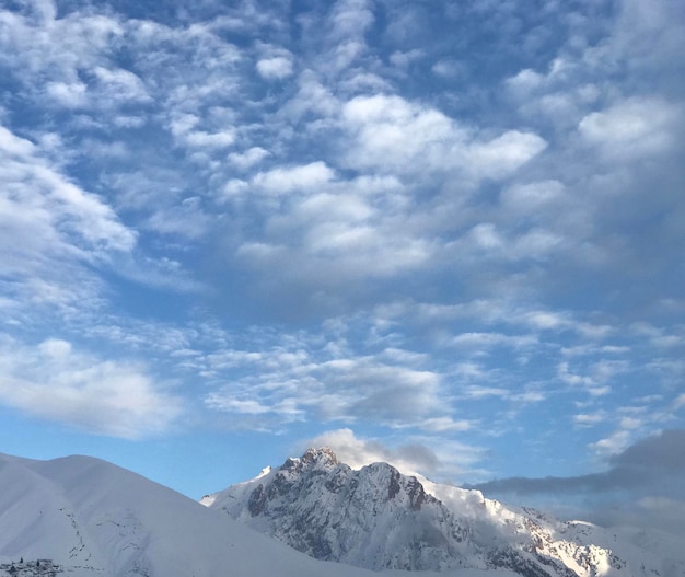 Clouds On Snowy Hills