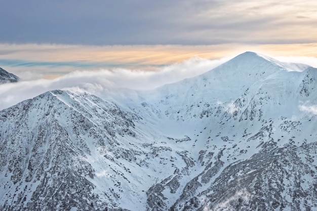 Clouds on top of Kasprowy Wierch in Zakopane in Tatras in winter. Zakopane is a town in Poland in Tatra Mountains. Kasprowy Wierch is a mount in Zakopane and the most popular ski area in Poland