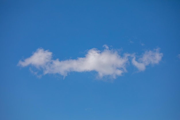 Clouds with exotic elongated shape on blue sky background