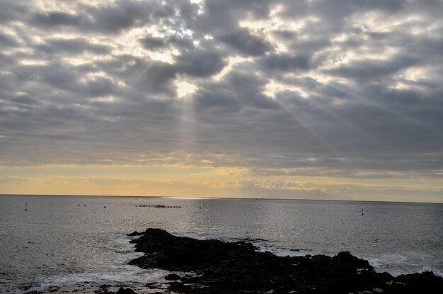 Cloudscape, colored clouds at sunset near the ocean