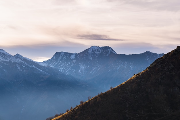 Cloudscape over majestic mountain range at sunset