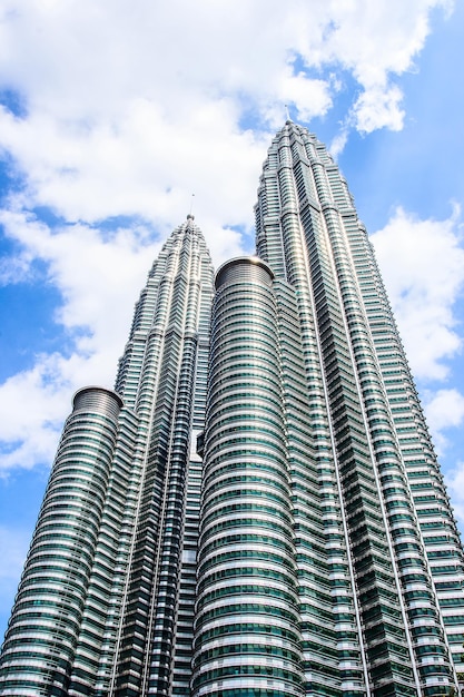 Cloudscape view of the Petronas Twin Towers at KLCC City Center