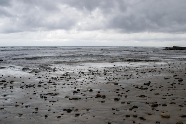 Cloudy beach shore coastline waves