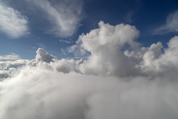 Cloudy sky from airplane window while flying