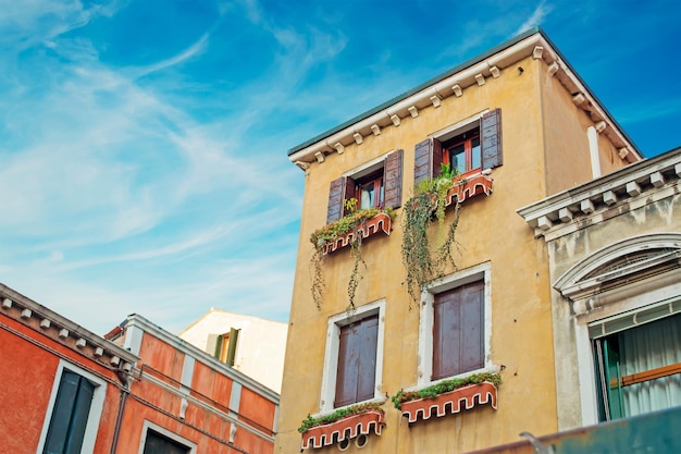 Cloudy sky over picturesque houses in Venice Italy