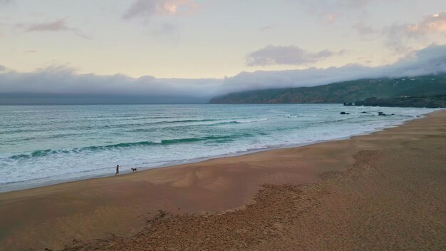 Cloudy sky sea dusk picturesque foamy waves drone view coastline landscape