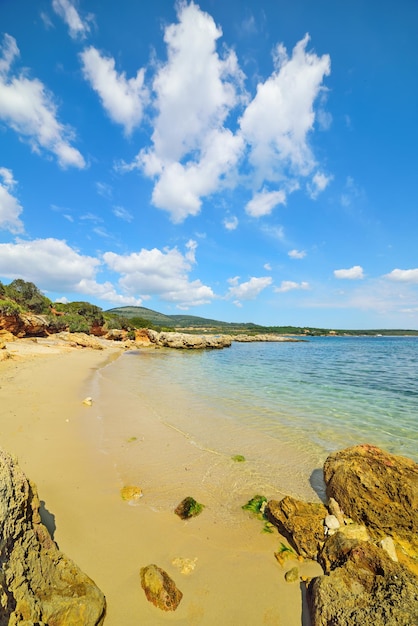 Cloudy sky over a small cove in Sardinia Italy