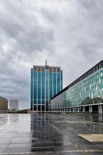 Cloudy urban landscape with reflections in the puddles of water