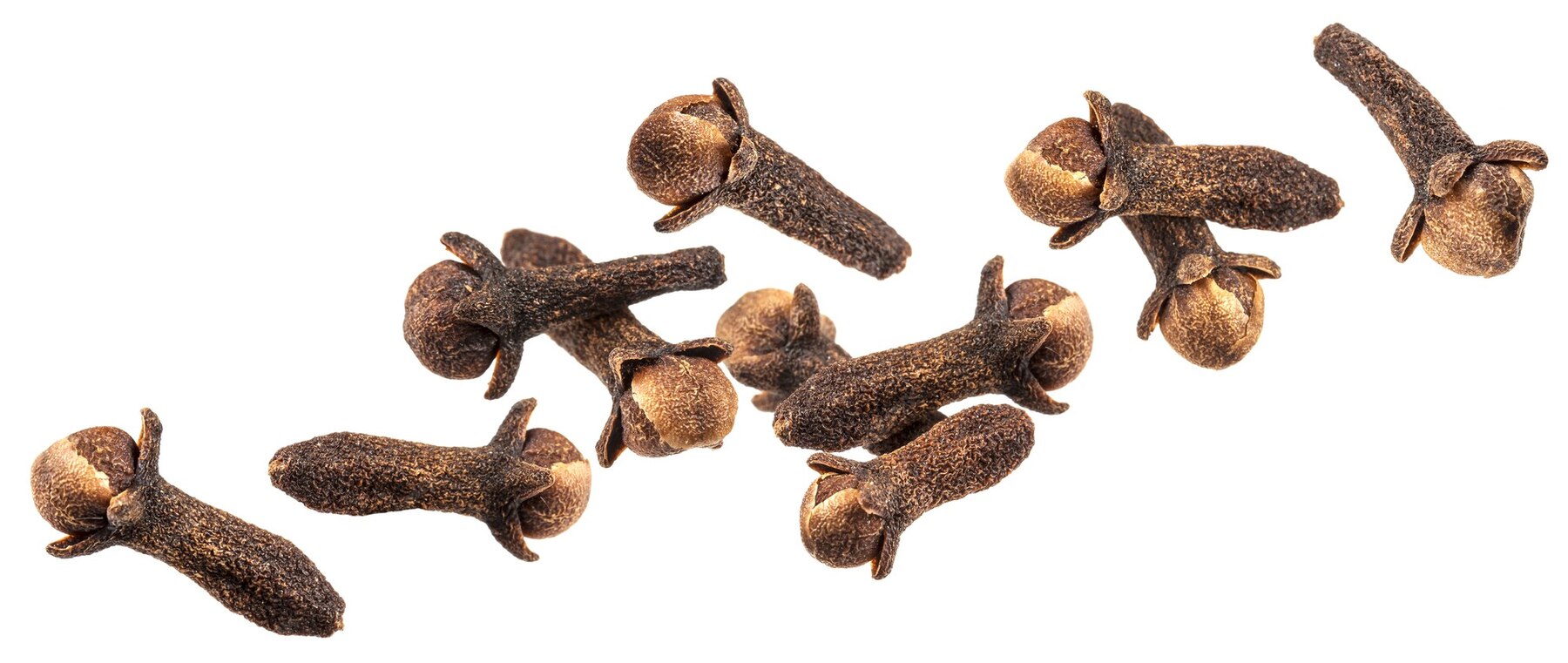 Premium Photo Clove spice, falling dry cloves isolated on white