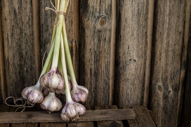 Cloves of garlic on vintage wood table