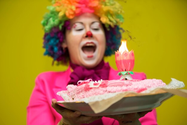 Photo the clown puts out the cake.birthday cake