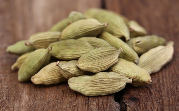 Clsoe up o some Cardamom seed on wooden surface