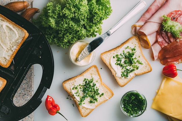 Club sandwich with ham salami smoked beef cheese lettuce\
arugula toast sandwich preparation