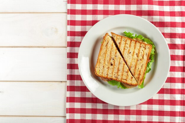 Club sandwich on wooden table