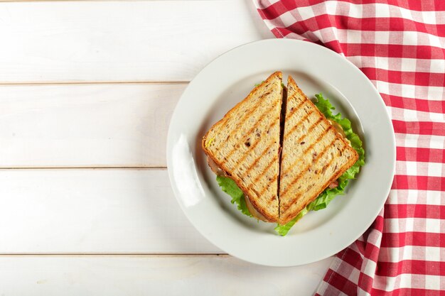 Club sandwich on wooden table