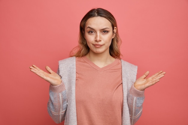 Clueless young girl showing empty hands 