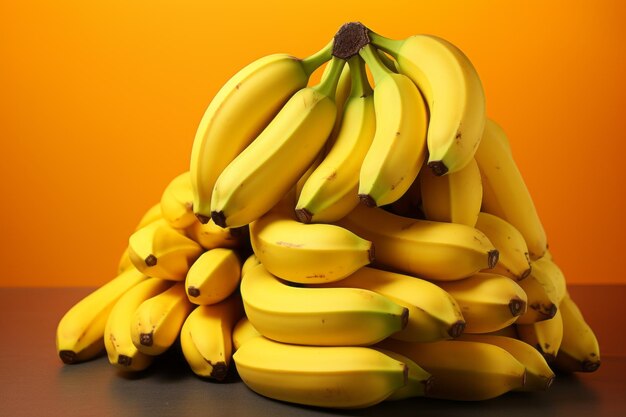 Cluster of bananas on bright yellow background