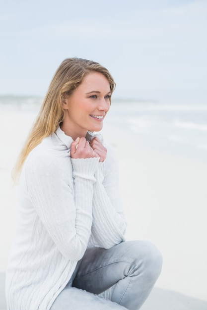 Cmiling casual young woman relaxing at beach