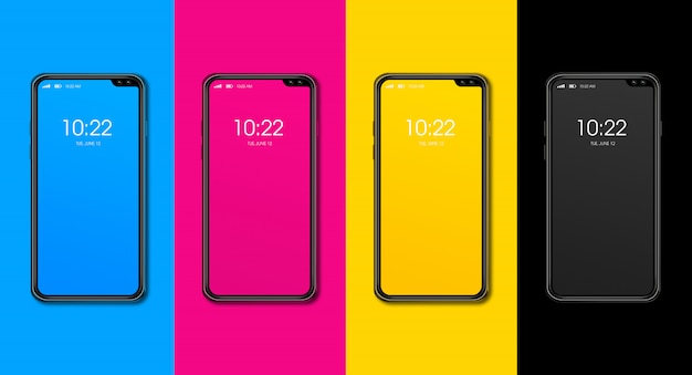 Photo cmyk smartphone set isolated on color surface. 3d render