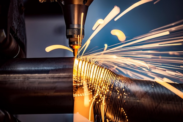 CNC Laser cutting of metal, modern industrial technology Making Industrial Details. The laser optics and CNC (computer numerical control) are used to direct the material or the laser beam generated.