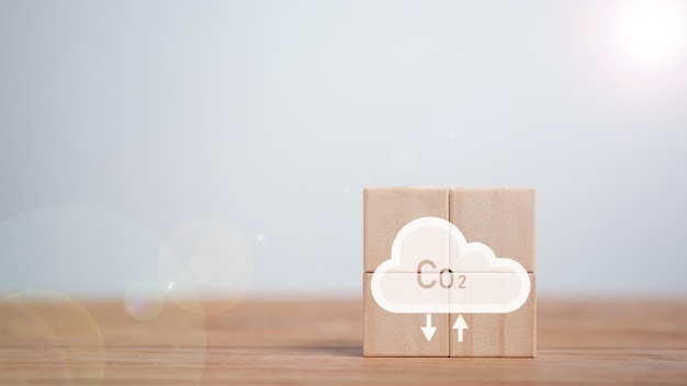 Emissioni di co2 concetto industrie business concept emissioni energie rinnovabili tecnologia sostenibile soluzioni ecologiche cubi di legno con icona di riduzione delle emissioni di co2