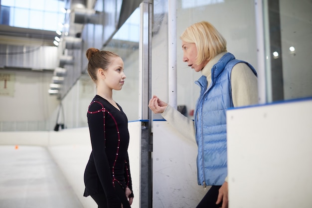 Coach Motivating Little Girl