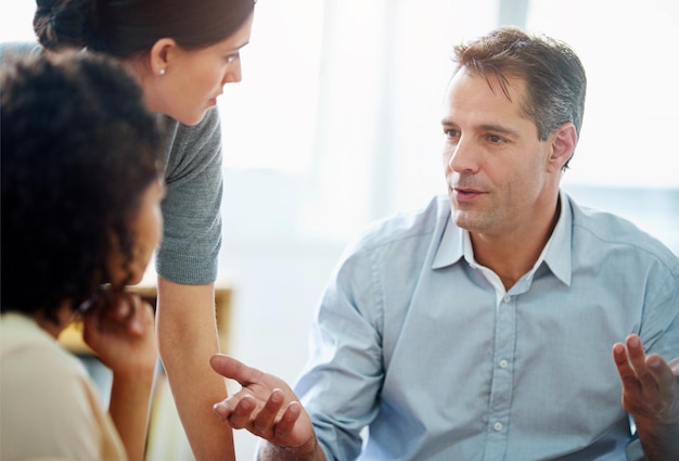 coaching development or training with manager and employee team in office together for learning collaboration discussion and explain with mature mentor talking to staff in workplace for planning