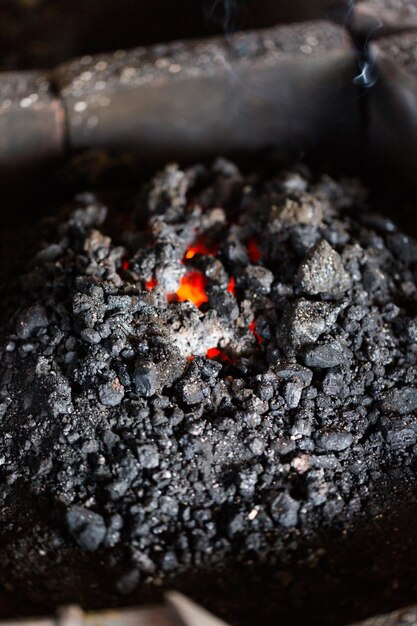 Coal in the forge of blacksmith shop.