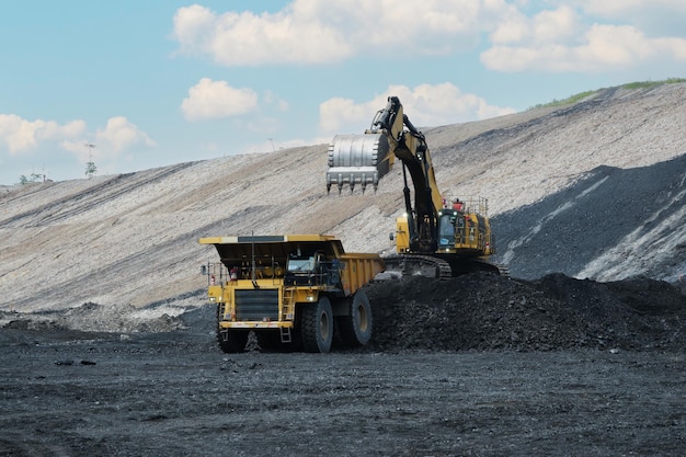 Coal loading from excavator into truck coal mine industry